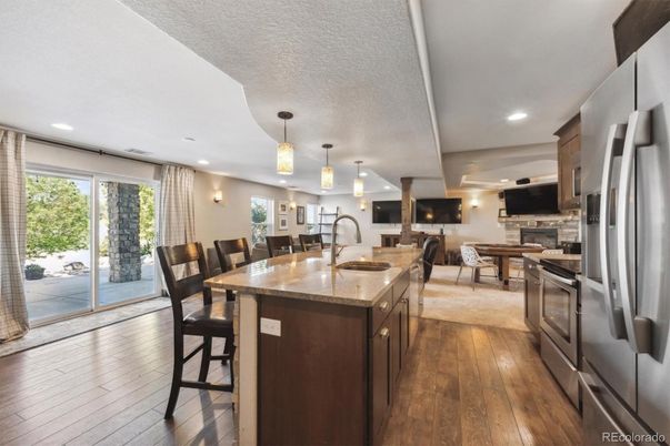Dining room, Interior, Kitchen, Living room, Pendant Lights, Recessed Lighting, Stainless Steel Appliances, Wood Texture Flooring