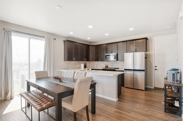 Dining room, Interior, Kitchen, Recessed Lighting, Stainless Steel Appliances, Wood Texture Flooring