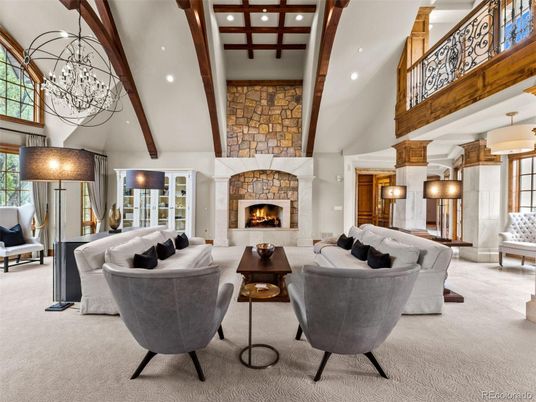Chandelier, Fireplace, Interior, Living room, Recessed Lighting, Stone Walls, Wooden Beams