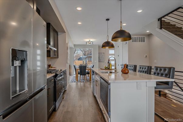 Dining room, Interior, Kitchen, Pendant Lights, Recessed Lighting, Stainless Steel Appliances, Wood Texture Flooring