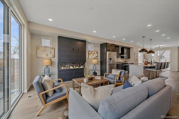 Dining room, Fireplace, Interior, Kitchen, Living room, Pendant Lights, Recessed Lighting, Stainless Steel Appliances, Wood Texture Flooring