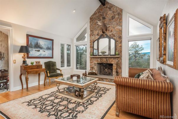 Fireplace, Interior, Living room, Recessed Lighting, Stone Walls, Wood Texture Flooring