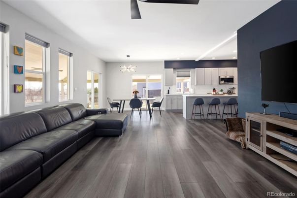 Dining room, Interior, Kitchen, Living room, Recessed Lighting, Stainless Steel Appliances, Wood Texture Flooring