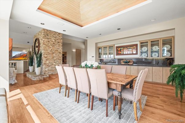Dining room, Fireplace, Interior, Recessed Lighting, Stone Walls, Wood Texture Flooring