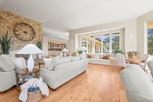 Dining room, Fireplace, Interior, Living room, Recessed Lighting, Stone Walls, Wood Texture Flooring