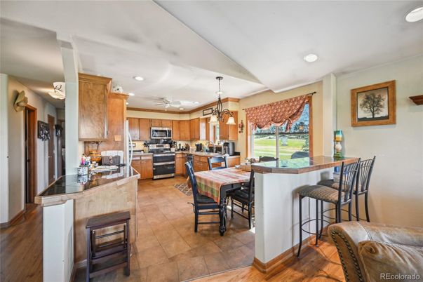 Dining room, Interior, Kitchen, Pendant Lights, Recessed Lighting, Stainless Steel Appliances, Wood Texture Flooring