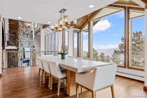 Chandelier, Dining room, Fireplace, Interior, Recessed Lighting, Stone Walls, Wood Texture Flooring