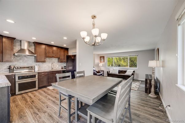 Chandelier, Dining room, Interior, Kitchen, Living room, Recessed Lighting, Stainless Steel Appliances, Wood Texture Flooring