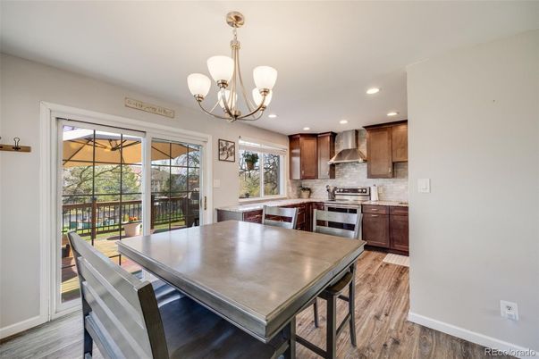 Chandelier, Dining room, Interior, Kitchen, Recessed Lighting, Stainless Steel Appliances, Wood Texture Flooring