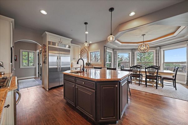 Chandelier, Dining room, Interior, Kitchen, Pendant Lights, Recessed Lighting, Stainless Steel Appliances, Wood Texture Flooring