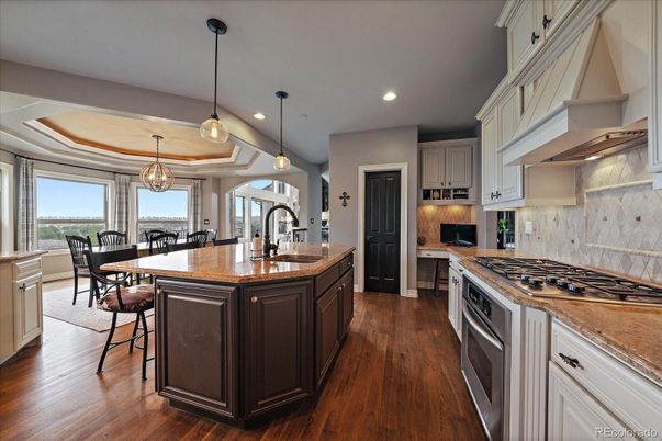 Chandelier, Dining room, Interior, Kitchen, Pendant Lights, Recessed Lighting, Stainless Steel Appliances, Wood Texture Flooring