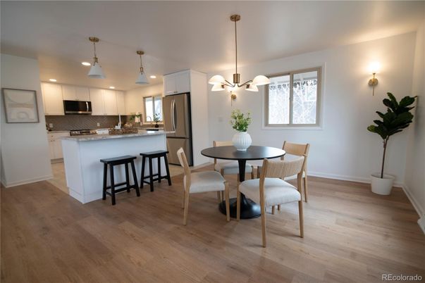 Dining room, Interior, Kitchen, Pendant Lights, Recessed Lighting, Stainless Steel Appliances, Wood Texture Flooring