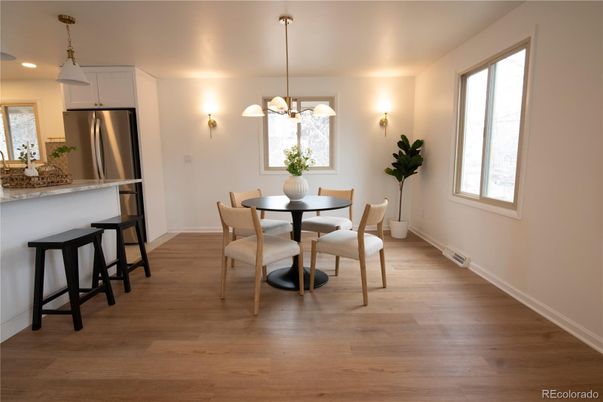 Dining room, Interior, Kitchen, Pendant Lights, Recessed Lighting, Stainless Steel Appliances, Wood Texture Flooring