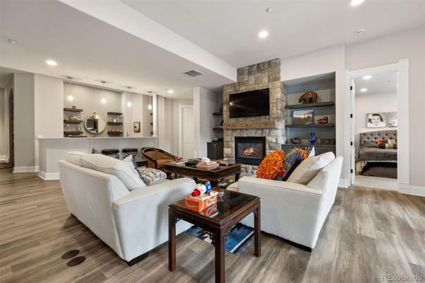 Fireplace, Interior, Living room, Pendant Lights, Recessed Lighting, Stone Walls, Wood Texture Flooring