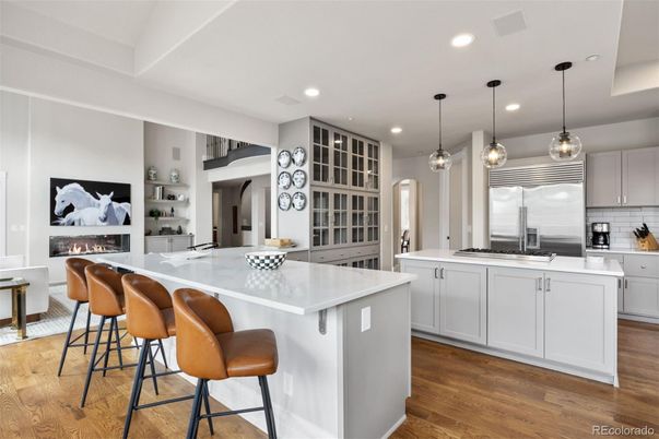 Fireplace, Interior, Kitchen, Pendant Lights, Recessed Lighting, Stainless Steel Appliances, Wood Texture Flooring