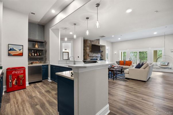 Fireplace, Interior, Kitchen, Living room, Pendant Lights, Recessed Lighting, Stainless Steel Appliances, Wood Texture Flooring