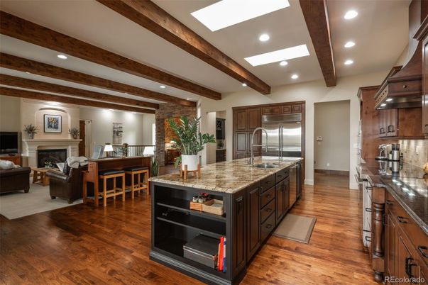 Fireplace, Interior, Kitchen, Living room, Recessed Lighting, Stainless Steel Appliances, Stone Walls, Wooden Beams, Wood Texture Flooring