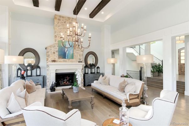 Chandelier, Fireplace, Interior, Living room, Recessed Lighting, Stone Walls, Wooden Beams, Wood Texture Flooring