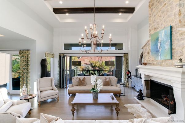 Chandelier, Fireplace, Interior, Living room, Recessed Lighting, Stone Walls, Wood Texture Flooring