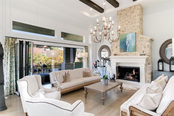 Chandelier, Fireplace, Interior, Living room, Recessed Lighting, Stone Walls, Wooden Beams, Wood Texture Flooring