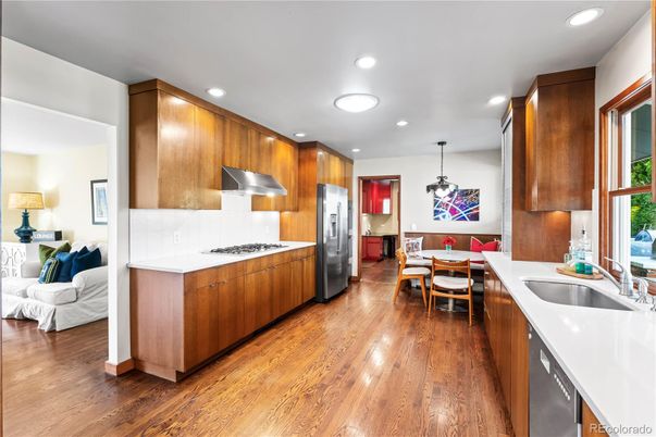 Dining room, Interior, Kitchen, Pendant Lights, Recessed Lighting, Stainless Steel Appliances, Wood Texture Flooring
