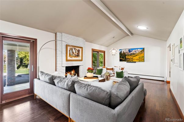 Dining room, Fireplace, Interior, Living room, Pendant Lights, Stone Walls, Wood Texture Flooring