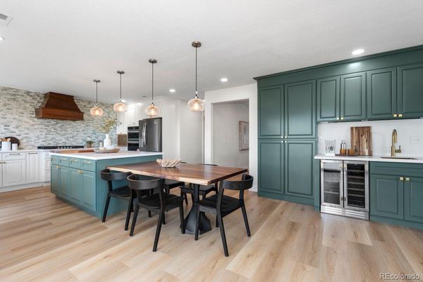 Interior, Kitchen, Pendant Lights, Recessed Lighting, Stainless Steel Appliances, Stone Walls, Wood Texture Flooring