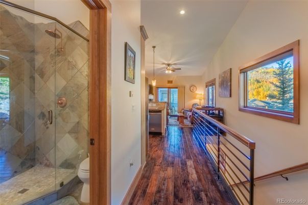 Bathroom, Glass Shower, Interior, Pendant Lights, Recessed Lighting, Wood Texture Flooring