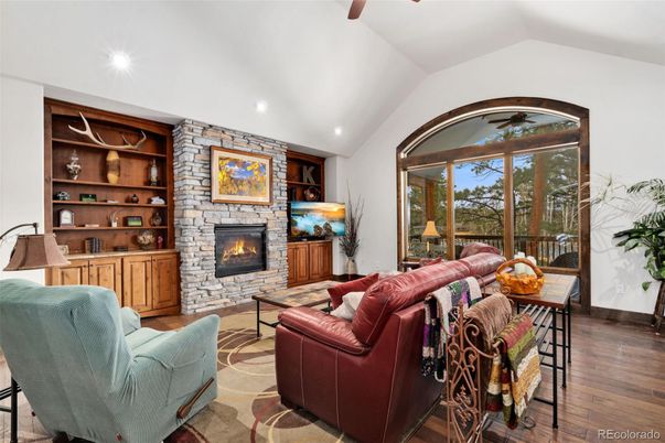 Fireplace, Interior, Living room, Recessed Lighting, Stone Walls, Wood Texture Flooring