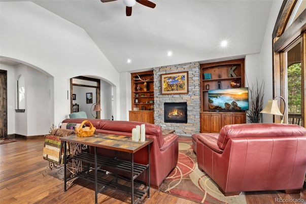 Fireplace, Interior, Living room, Recessed Lighting, Stone Walls, Wood Texture Flooring
