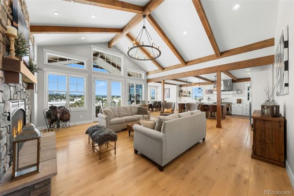 Chandelier, Dining room, Fireplace, Interior, Living room, Pendant Lights, Recessed Lighting, Wooden Beams, Wood Texture Flooring