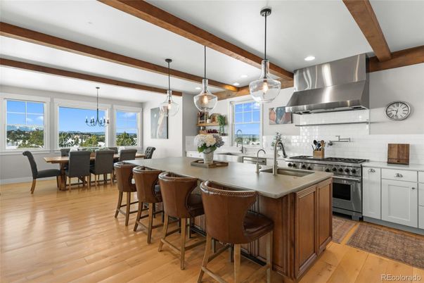 Chandelier, Dining room, Interior, Kitchen, Pendant Lights, Recessed Lighting, Stainless Steel Appliances, Wooden Beams, Wood Texture Flooring