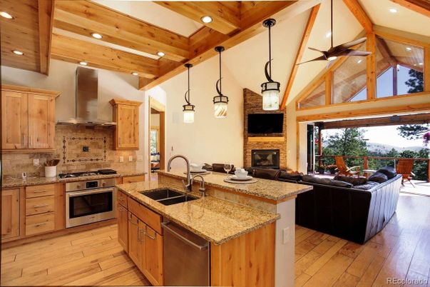 Fireplace, Interior, Kitchen, Living room, Pendant Lights, Recessed Lighting, Stainless Steel Appliances, Wooden Beams, Wooden Ceilings, Wood Texture Flooring