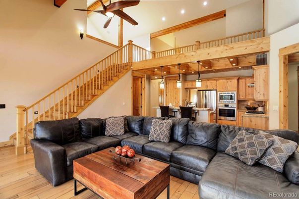 Dining room, Interior, Kitchen, Living room, Pendant Lights, Recessed Lighting, Stainless Steel Appliances, Wooden Beams, Wood Texture Flooring