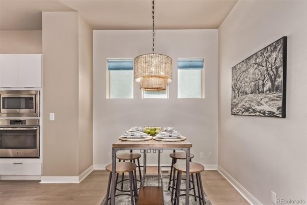 Chandelier, Dining room, Interior, Kitchen, Stainless Steel Appliances, Wood Texture Flooring