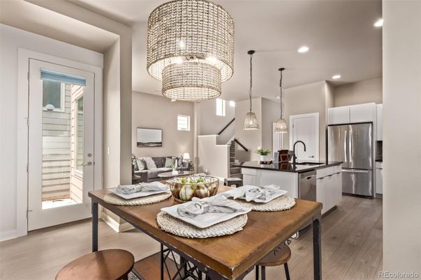 Chandelier, Dining room, Interior, Kitchen, Pendant Lights, Recessed Lighting, Stainless Steel Appliances, Wood Texture Flooring