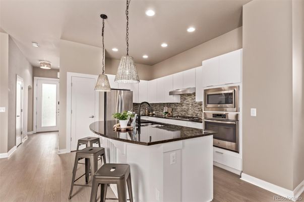 Interior, Kitchen, Pendant Lights, Recessed Lighting, Stainless Steel Appliances, Wood Texture Flooring
