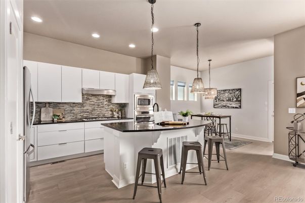 Dining room, Interior, Kitchen, Pendant Lights, Recessed Lighting, Stainless Steel Appliances, Wood Texture Flooring