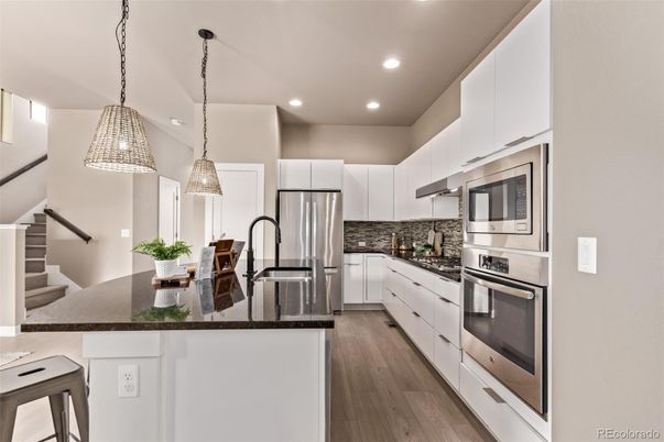 Interior, Kitchen, Pendant Lights, Recessed Lighting, Stainless Steel Appliances, Wood Texture Flooring