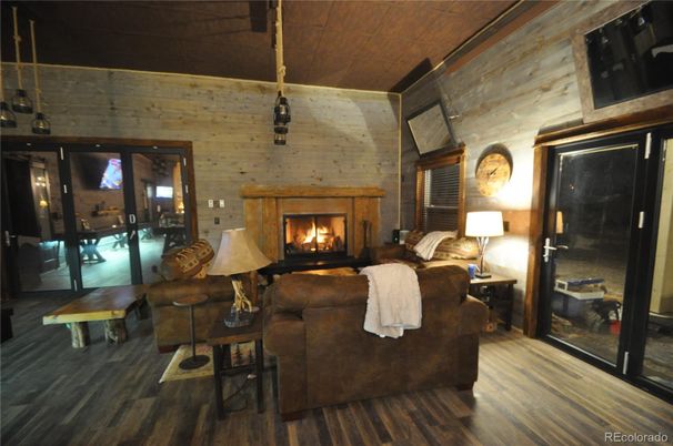 Fireplace, Interior, Living room, Pendant Lights, Stone Walls, Wood Texture Flooring