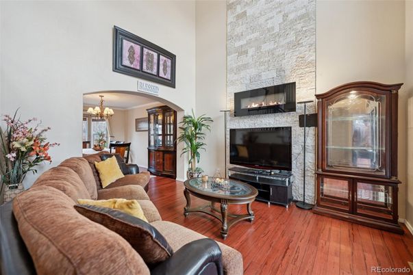 Chandelier, Fireplace, Interior, Living room, Stone Walls, Wood Texture Flooring