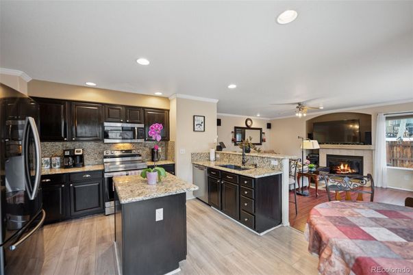 Fireplace, Interior, Kitchen, Recessed Lighting, Wood Texture Flooring