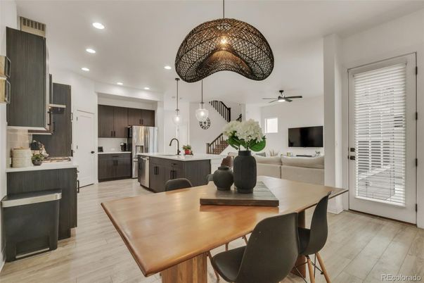 Dining room, Interior, Kitchen, Pendant Lights, Recessed Lighting, Stainless Steel Appliances, Wood Texture Flooring