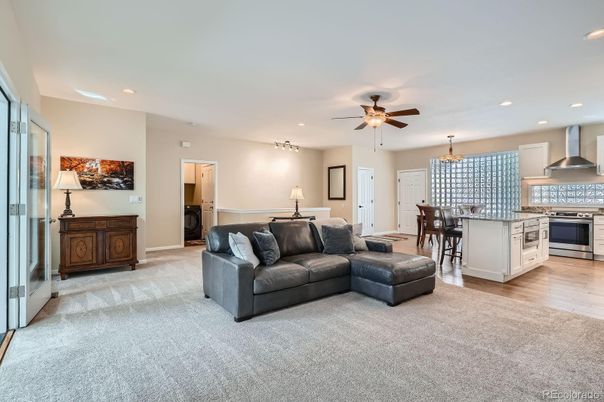 Chandelier, Dining room, Interior, Kitchen, Living room, Pendant Lights, Recessed Lighting, Stainless Steel Appliances, Wood Texture Flooring
