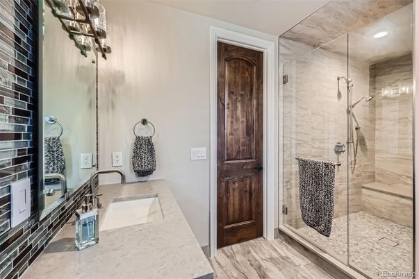 Bathroom, Glass Shower, Interior, Marble Walls, Recessed Lighting, Wood Texture Flooring