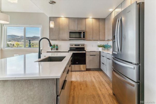 Interior, Kitchen, Pendant Lights, Recessed Lighting, Stainless Steel Appliances, Wood Texture Flooring