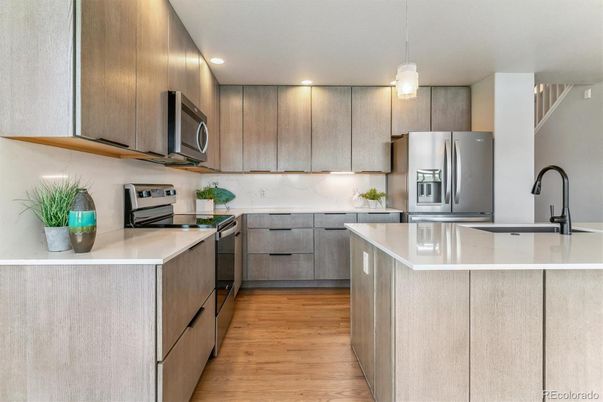Interior, Kitchen, Pendant Lights, Recessed Lighting, Stainless Steel Appliances, Wood Texture Flooring
