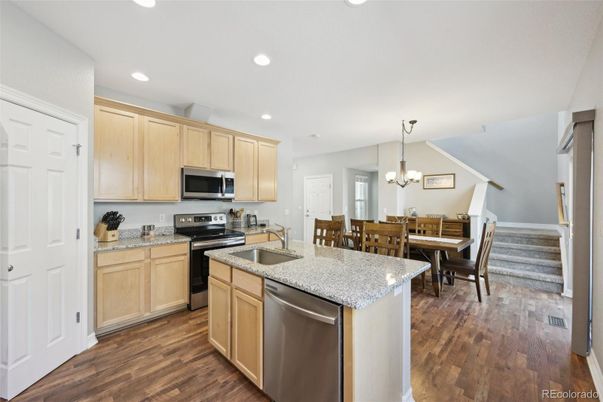 Chandelier, Dining room, Interior, Kitchen, Recessed Lighting, Stainless Steel Appliances, Wood Texture Flooring
