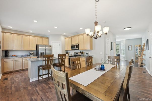 Chandelier, Dining room, Interior, Kitchen, Recessed Lighting, Stainless Steel Appliances, Wood Texture Flooring