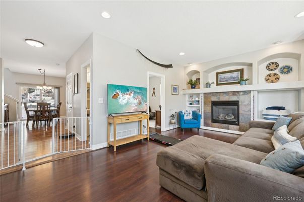 Chandelier, Dining room, Fireplace, Interior, Living room, Recessed Lighting, Wood Texture Flooring
